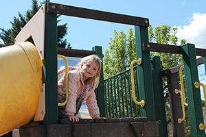 girl on play structure